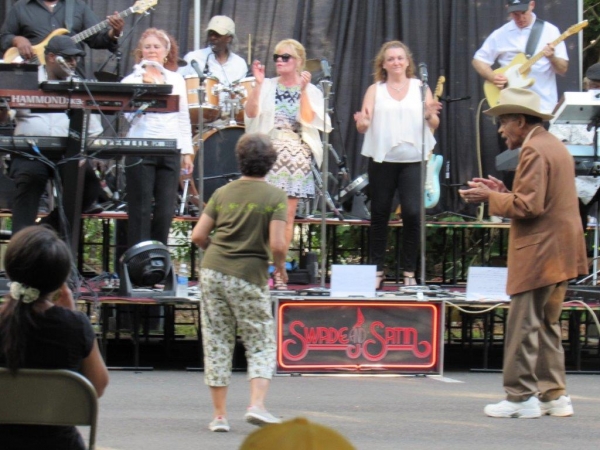 People dancing to the live music at the Celebrate The "O" BBQ event.