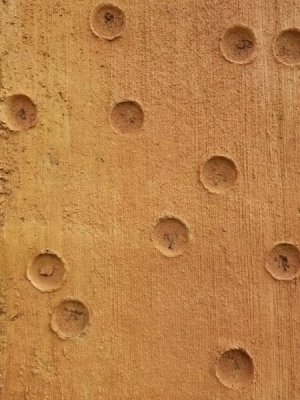 Closeup of texture of The Lawyer pillar. A gavel made the pattern of random dots.